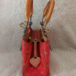 Mid- size Dooney Burke bag. Three compartments.